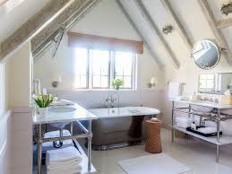 A bathroom ceiling joins forces with the floor, windows, and wall to create a harmonious background for the other features like the shower, faucets, fixtures and cabinets present in a bathing room. 15 Attic Bathrooms To Inspire Your Next Renovation