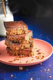Recipe for easy no bake chocolate biscuit cake made with digestive biscuits. Chocolate Tiffin Traybake Lost In Food