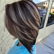 The top portion of the hair is longer and curly falling to the side, while the sides are shorter. 58 Of The Most Stunning Highlights For Brown Hair