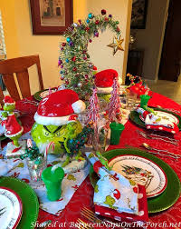 A Whimsical How The Grinch Stole Christmas Table Setting In 2020 Christmas Table Coastal Christmas Decor Purple Christmas Tree