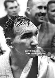 Gene Fullmer talks to the media after the 15 round draw fight against...  News Photo