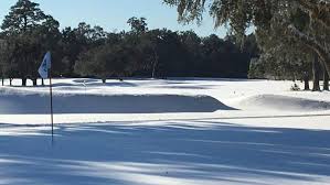 Snow, cold temperatures sock in golf ...