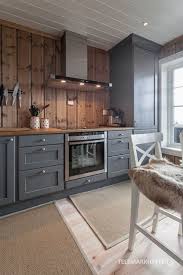 Kitchen Love The Grey Cabinetry With Wood Plank Backsplash Unique Hytte Kjokken Home Kitchens Kitchen Renovation Kitchen Design