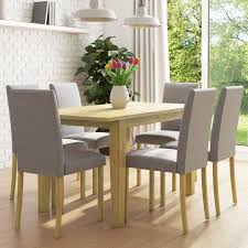 Instead of shopping around for a table to match your existing chairs (or vice versa), buying a dining room set means you go shopping once and you're done. New Haven Oak Extendable Dining Set With 6 Grey Fabric Chairs Furniture123