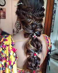 Right from the wedding function to a casual one, this hairstyle will make you fall in love with its centralized segmented theme. 50 Trending Indian Bridal Hairstyles For Haldi Mehndi