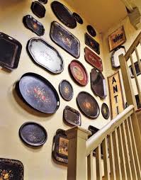 Many popular versions of tole trays feature elebrate floral pictures, with gold details. Decorating With Tongue In Cheek Antiques Tole Tray Vintage Trays Plates On Wall