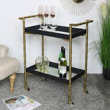 H deluxe gold metal oval mirrored bar cart crafted according to the highest standards crafted according to the highest standards from tempered glass and iron, this deluxe bar cart is the perfect accessory for entertaining. Gold Mirrored Bar Cart Drinks Trolley