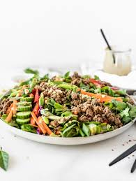 Blend soy sauce, vinegar, brown sugar, sesame oil, garlic, and ginger together in a blender or food processor until dressing is smooth. Thai Salad With Ginger Ground Beef And Peanut Dressing Lively Table