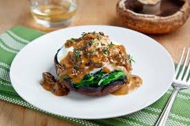 Roasted Portobello Mushrooms With Poached Eggs In A Creamy Mushroom Sauce Recipe Recipes Veggie Dishes Roasted Portobello Mushrooms