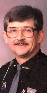 Man charged with desecrating deputy's grave