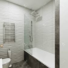 See how top designers create lovely loos with marble, ceramic, porcelain and glass tile. Modern Bathroom Design With Tiles Under Concrete And Wave Stock Photo Picture And Royalty Free Image Image 116762714