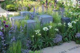 Though The Granite Blocks In This Garden Are Symbolic Of Returning Soldiers They Illustrate The Artistry That C Landscape Design Garden Design Garden Features