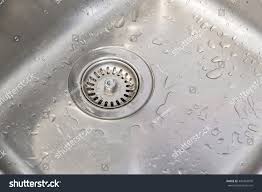 wet sink after dishes were washed stock