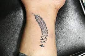 Feather Tattoo Meaning And 20 Tattoo Ideas To Discover Discover Feather Ideas Meaning Ta Cool Small Tattoos Small Tattoos For Guys Tattoo Designs Men