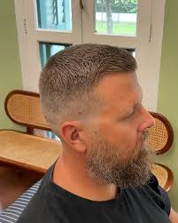 A men's crew cut is a short hairstyle where the hair