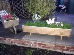 Antiques, diy options and some creative ways to display flowers. Wooden Pallet Wheelbarrow Planter Easy Pallet Ideas