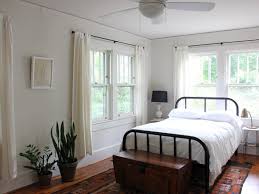 Fake high ceilings by hanging your curtains as high as possible. How To Hang Curtains Without Drilling Into Walls Apartment Therapy
