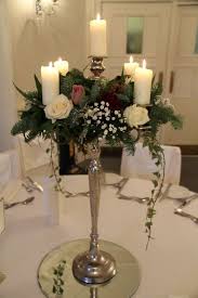 Pin By Flowers Side On Over 40 Christmas Wedding Flowers Candelabra Wedding Winter Floral Arrangements