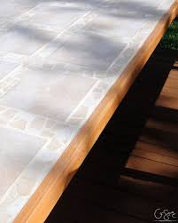 An inexpensive option like ikea's lack side table ($10) works great for this, or you can opt to refresh old or thrifted furniture. Remodelaholic How To Replace A Patio Table Top With Tile