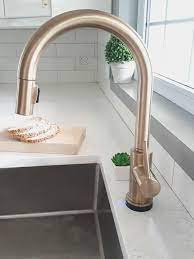 A kitchen faucet has the strength to make or break the look of your kitchen. Fixing My Design Mistake With A Gold Kitchen Faucet By Delta Gold Kitchen Faucet Brass Kitchen Faucet Gold Kitchen