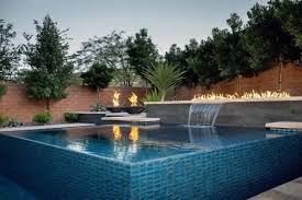 Swimming pools can greatly add a good ambiance to one's home. Top 60 Best Pool Waterfall Ideas Cascading Water Features