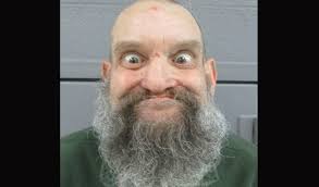 Good Thing This Scary Looking Dude is Behind Bars!