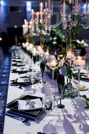 A black tie affair calls for candles and floral centrepieces rather than colourful balloons and streamers. Black Tie White Tulips Wedluxe Magazine Birthday Dinner Party Dinner Party Decorations Gala Decorations