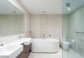A combination shower and bathtub, with movable screen. Glass Shower Screens Safeguard Peterborough