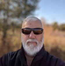 Should I pack rain gear for a trip to Olympic National Park from July 4-10?