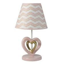 Supported on a slim metal frame and a rounded base, it can be placed on any table surface to give a stable display. Heart Table Lamp Target