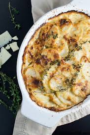 In a saucepan, heat up the cream with the bay leaves, thyme, garlic, nutmeg and some salt and pepper. Potatoes Au Gratin Scalloped Potatoes Stuck On Sweet