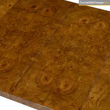 It has 8 glass inserts as well as 1 leaf that has 4 inserts. Hollywood Regency Burled Olive Wood Dining Table By Century Furniture
