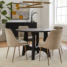 Glass dining tables are tough, too. Tanner Solid Wood Round Dining Table