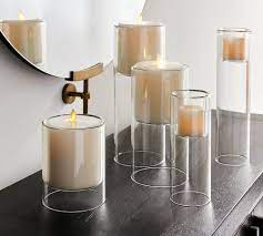 Why not experiment with our glass hurricane candle holders for a sleek and simple look? Floating Glass Candleholders Pottery Barn