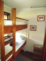 Our log bunk beds are the perfect solution for small cabins creating additional sleeping room in the same amount of floor space. Bunk Bed Area In Queen And Double Cabins Picture Of Tumut Log Cabins Tripadvisor