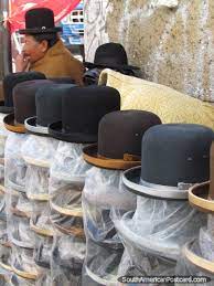 A Woman Sells Hats To The Hat Ladies Of La Paz Bolivia Photo Mark Berman Bolivia Bolivia Travel La Paz