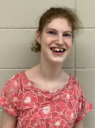 Maybe Ms. Sharp's favorite photo of the day…. Sweet Sara Gautier who  brought her East Central Hornets to our JCES Job Extravaganza ended up with  an unexpected tag-a-long from our Fish Market!