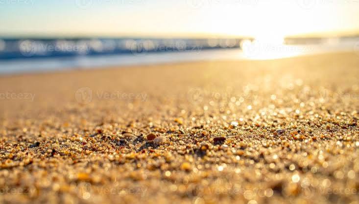 Golden Beach Sand Close Up at Sunrise with Soft Ocean Waves and Bokeh Lights 72286399 Stock Photo at Vecteezy