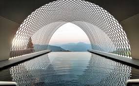Noa Gives Arches A Modern Twist At Gloriette Guesthouse In Italy Water Architecture Futuristic Architecture Architecture