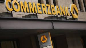 A man walks past a logo of commerzbank (photo credit: Commerzbank Swings To Quarterly Net Loss Amid Pandemic