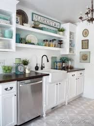 Here, designer andrea schumacher opted for just two small shelves in lieu of upper cabinets, making the fanciful floral wallpaper the star. White Kitchen Decor Ideas The 36th Avenue