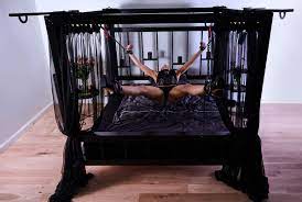 A bed with a BDSM set for lovers of erotic games.