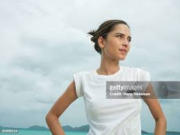 Wonderful Wet Woman In White T-Shirt In The City Near The Stools Stock  Photo, Picture And Royalty Free Image. Image 79401617.