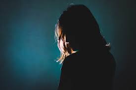 silhouette of depress woman standing in the dark with light shine behind |  Billy Graham Evangelistic Association - UK