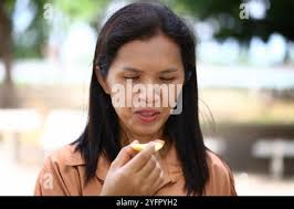 Natural very close up fruit portrait of fallen green apples and crinkled  leaves in crisp autumn light. Adam and Eve, Albrecht Dürer, sin,Eden,  Genesis Stock Photo