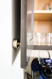 Open the door and hold it open with one hand. How To Keep A Cabinet Door From Opening Too Far The Easiest Way