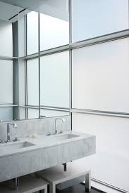 This modern bathroom has a floating vanity with lighting below. Floating Marble Vanity Modern Bathroom Sasha Bikoff