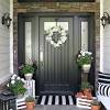 To optimize the area, consider adding a tray or bowl to catch entry debris and a small hook on a nearby wall for a bag or coat. 1