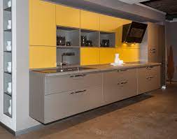 A grey gloss kitchen with contrasting quartz glass effect splashback. Pros Cons Of Matt Kitchen Cabinets And Worktops Designer Kitchens