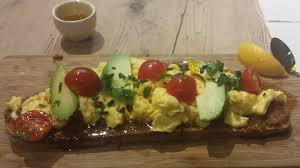 Delicious Scrambled Egg Toast With Avocado And Cherry Tomtao Drizzled With Chilli Oil Picture Of Le Pain Quotidien London Tripadvisor